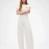 Pantaloni a vita alta con pieghe ad arco GAP × Victoria Beckham