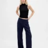 Pantaloni a vita bassa con pieghe e gamba larga 365
