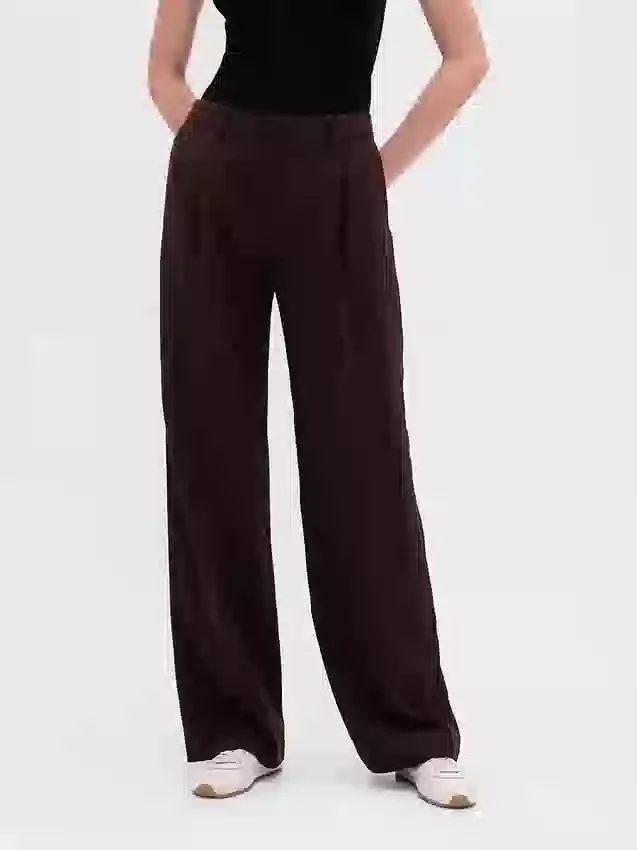 Pantaloni a vita bassa con pieghe e gamba larga 365