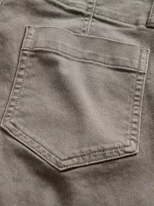 Pantaloni a vita bassa in twill dal taglio lungo e slanciato