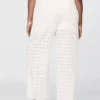 Pantaloni a vita media con occhielli e gamba ampia
