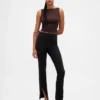 Pantaloni a zampa con orlo a spacco in maglia doppia a vita alta