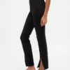 Pantaloni a zampa con orlo a spacco in maglia doppia a vita alta