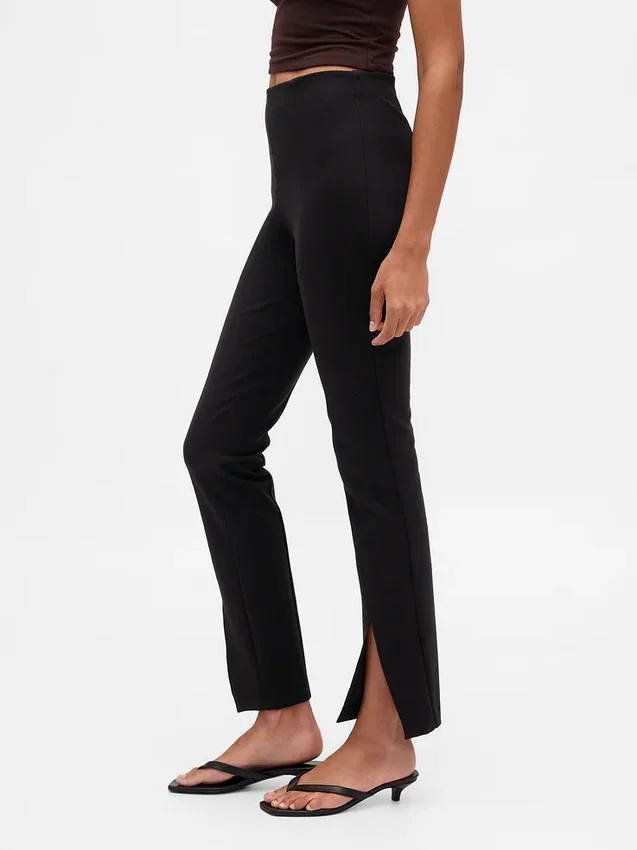 Pantaloni a zampa con orlo a spacco in maglia doppia a vita alta