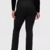 Pantaloni a zampa con orlo a spacco in maglia doppia a vita alta