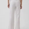 Pantaloni a zampa in misto lino a vita bassa