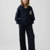Pantaloni da bambino a gamba larga, comodi e dalla vestibilità rilassata, in maglia a nido d’ape