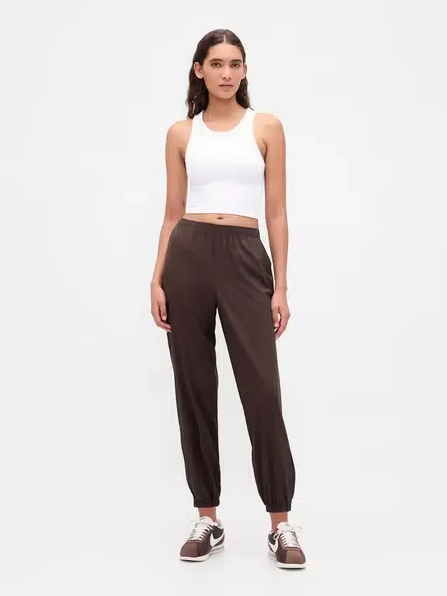 Pantaloni da jogging GapFit Tech a vita alta con orlo con cerniera