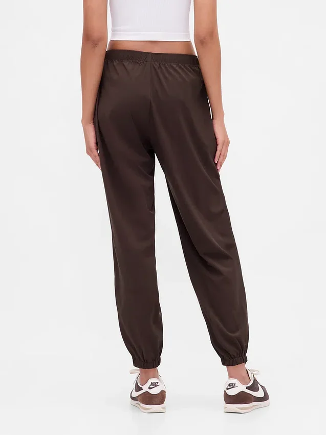 Pantaloni da jogging GapFit Tech a vita alta con orlo con cerniera