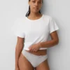 Tanga in cotone biologico elasticizzato con bordi in pizzo