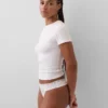 Tanga in cotone biologico elasticizzato con bordi in pizzo
