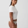 Tanga in cotone biologico elasticizzato con bordi in pizzo