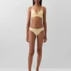 Tanga in cotone biologico elasticizzato con bordi in pizzo