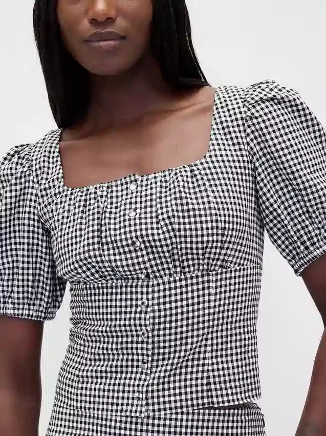 Top a corsetto corto con maniche a sbuffo in misto lino