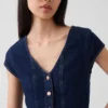 Top aderente in denim con maniche ad aletta e peplo