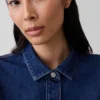 Top aderente in denim con peplo