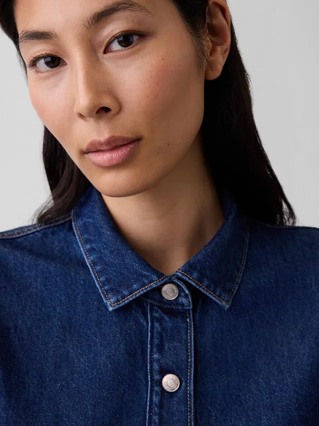 Top aderente in denim con peplo
