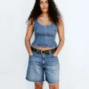 Top aderente in denim con peplo