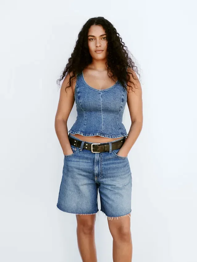 Top aderente in denim con peplo