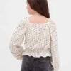 Top con peplo in maglia stropicciata per bambini