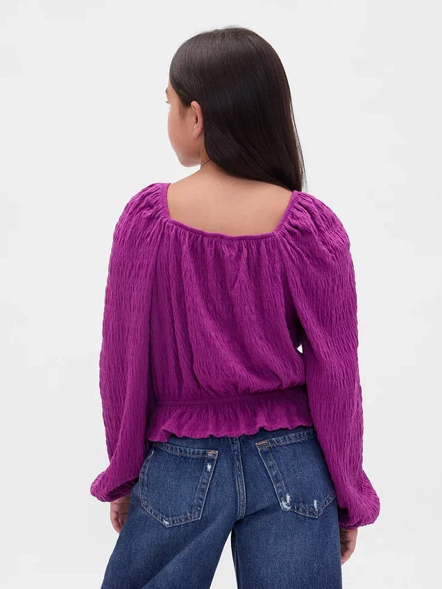 Top con peplo in maglia stropicciata per bambini