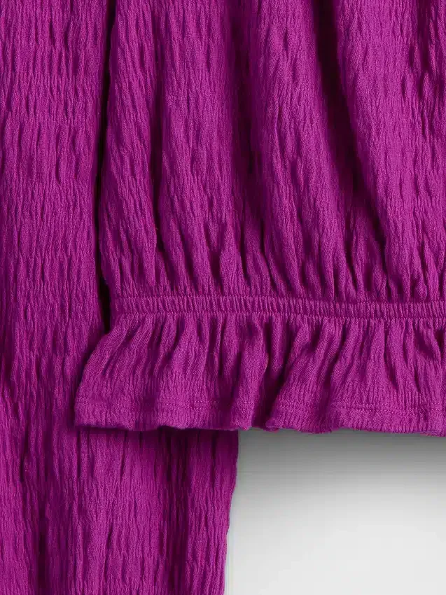 Top con peplo in maglia stropicciata per bambini