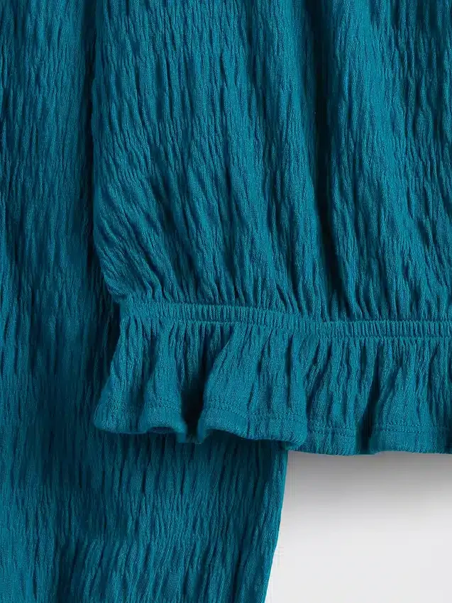 Top con peplo in maglia stropicciata per bambini