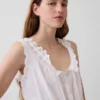 Top corto con peplo e lacci sul davanti