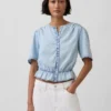 Top corto con peplo in denim