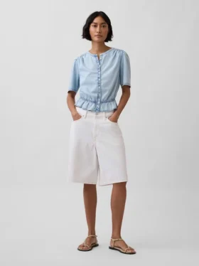 Top corto con peplo in denim