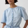 Top corto con peplo in denim