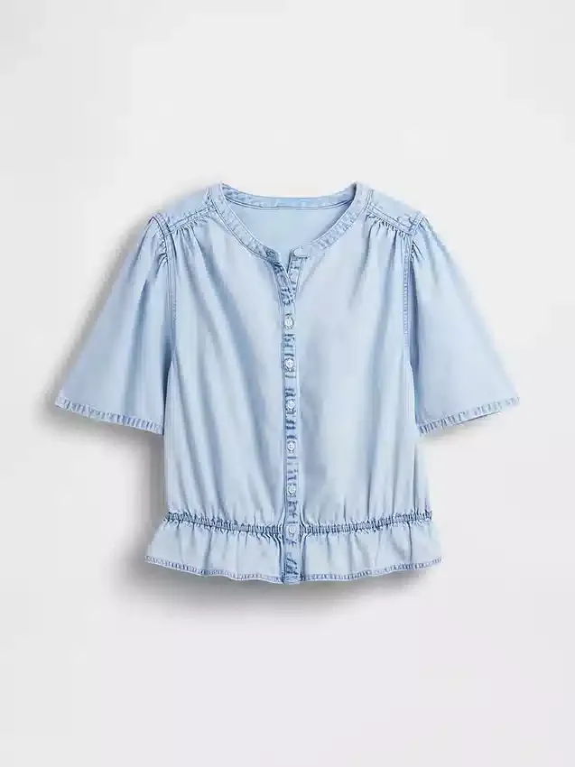 Top corto con peplo in denim