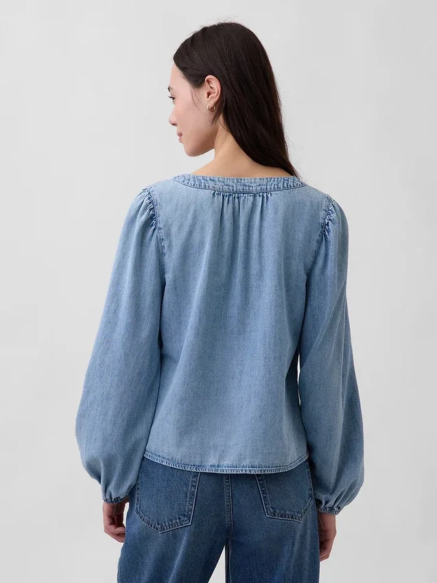 Top in denim con maniche a sbuffo