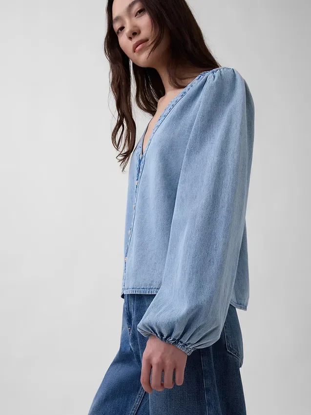 Top in denim con maniche a sbuffo
