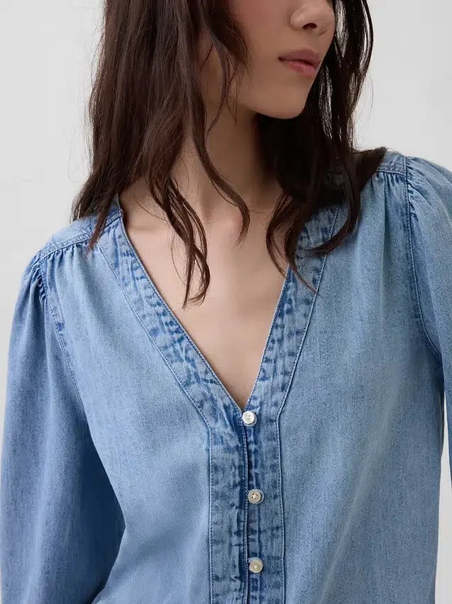 Top in denim con maniche a sbuffo