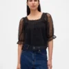 Top in tulle trasparente ricamato
