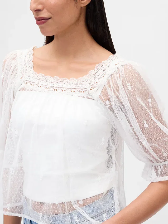 Top in tulle trasparente ricamato