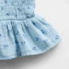 Top peplum smockato in garza di cotone per bambini