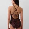 Tutina con spalline incrociate sulla schiena