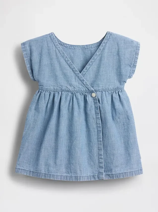 Vestito da neonato in denim con tasche ricamate