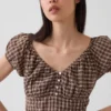 Vestito lungo con scollo a V e orlo con volant