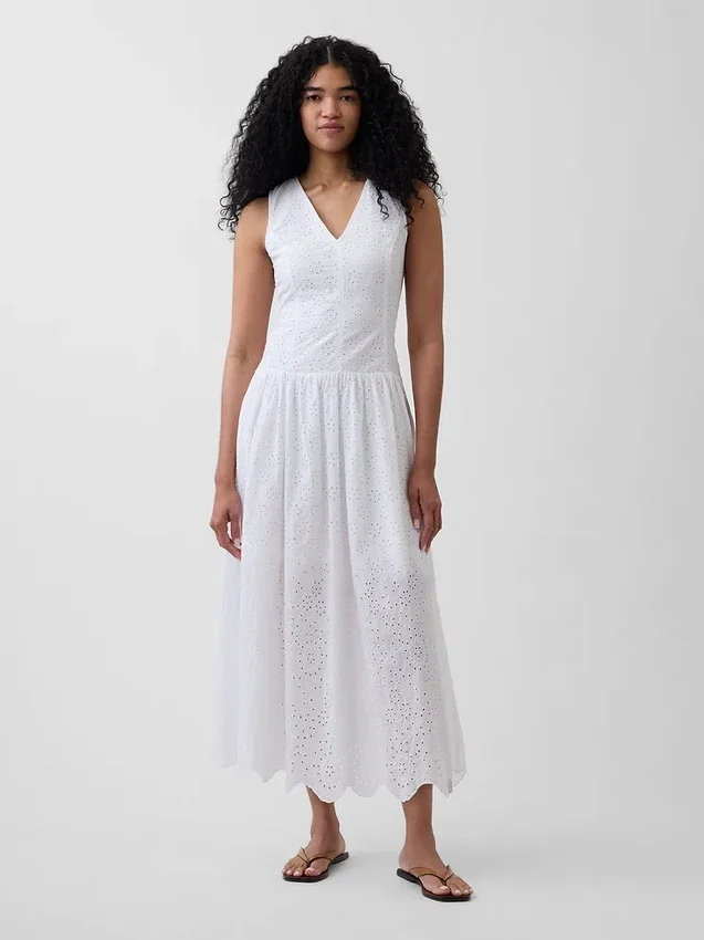 Vestito lungo con vita bassa e occhielli