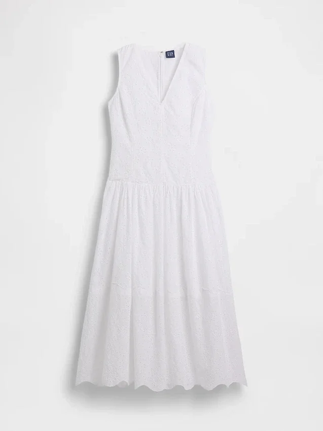 Vestito lungo con vita bassa e occhielli