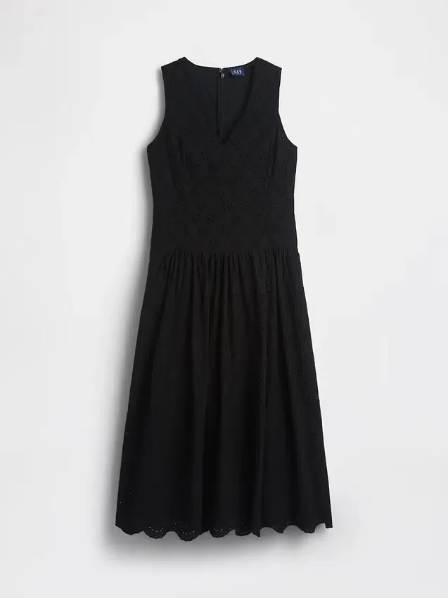 Vestito lungo con vita bassa e occhielli